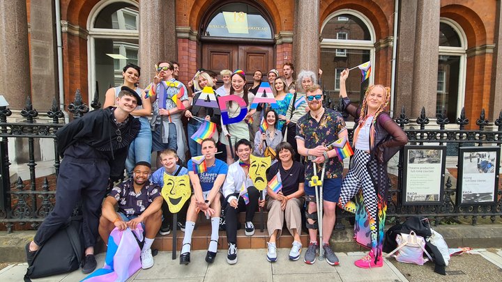A celebratory group of RADA students outside the RADA building getting ready to march at London's Pride Parade