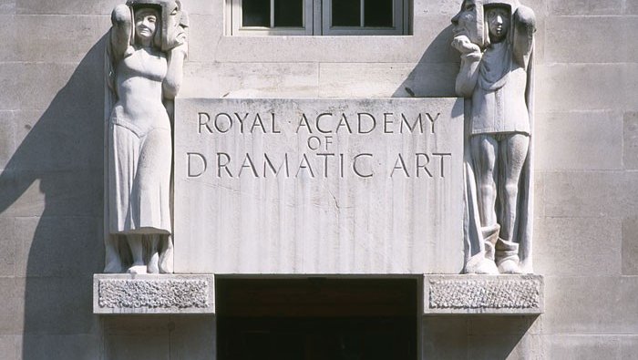 stone front entrance of Royal Academy of Dramatic Art with carvings