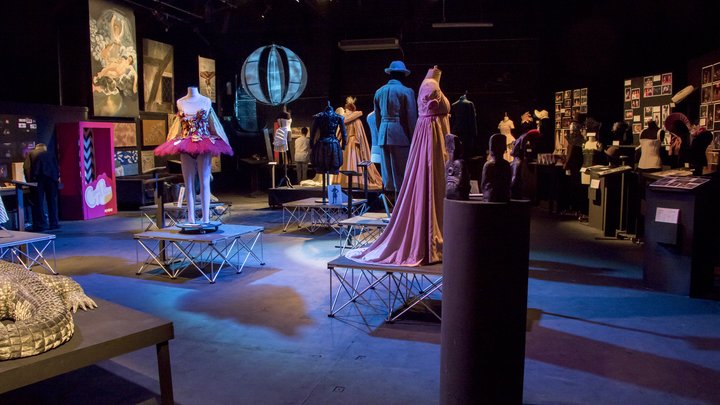 Image of exhibition installed, showing costume, scenic art and props