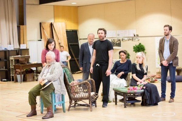 © Johan Persson group of actors in rehearsal studio for Platanov including James McArdle standing at the centre