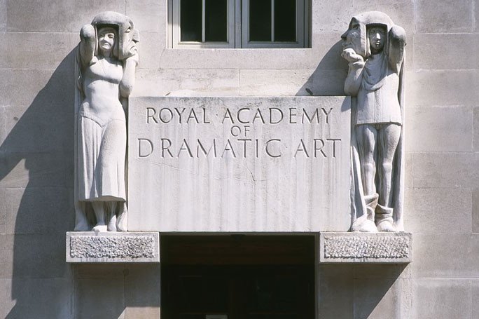 stone front entrance of Royal Academy of Dramatic Art with carvings