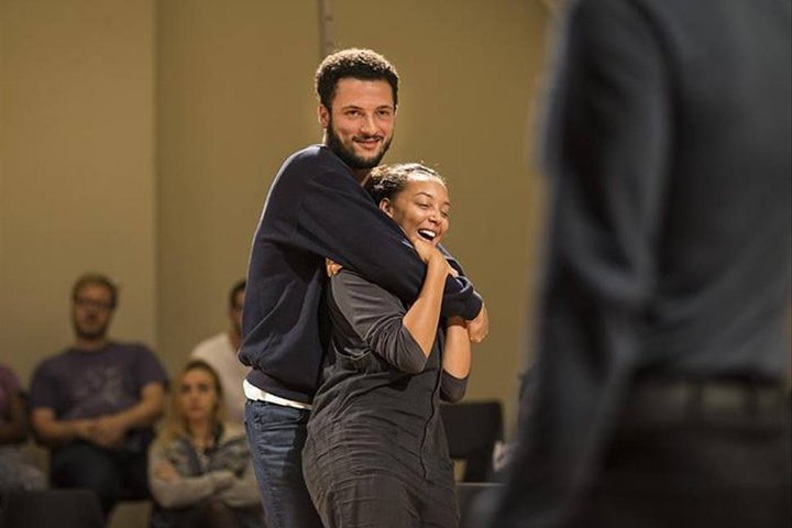 © Helen Maybanks Jamael Westman hugs a cast member in a scene from Torn at the Royal Court Theatre